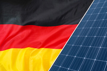 Solar panels against flag Germany background. Solar battery generates a pure electricity. Concept...