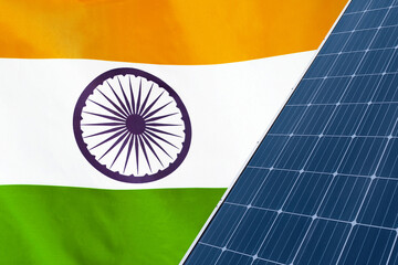 Solar panels against flag India background. Solar battery generates a pure electricity. Concept of...