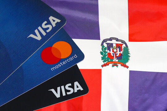 Visa card, MasterCard, debit cards on Dominican Republic flag background. Financial regulation sanctions against of Russia. 10 March 2022. Tel Aviv. Israel