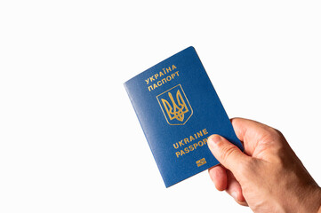 Biometric Ukrainian passport in a female hand on a white background. Minimalism. Identification, world travel, emigration, business, tourism.