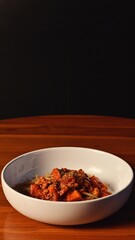 Tomato Sauce Pasta served hot on a wooden table on a black background.