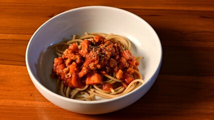 Tomato Sauce Pasta served hot on a wooden table.