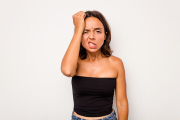 Young hispanic woman isolated on white background forgetting something, slapping forehead with palm and closing eyes.