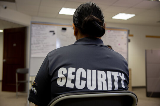 Security guard in uniform is training in meeting room