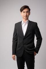 Young businessman wearing  suit over white background studio