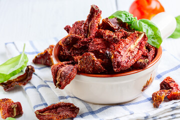 Dried tomatoes in a bowl close up.