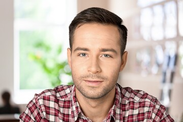 Obraz premium Happy positive millennial business man, company owner, startup leader, professional posing. Businessman indoor