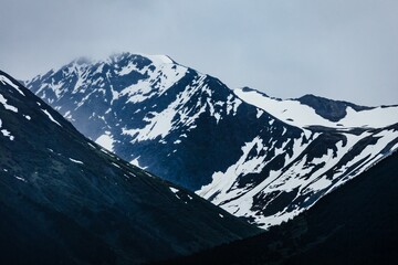 View of Mount Carlisle covered with snow under thick clouds on Carlisle Island