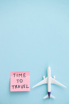 Travel concept on blue background with copy space. Airplane toy on blue color background.