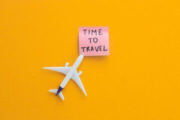 Travel concept on color background with copy space. Airplane toy on color background.