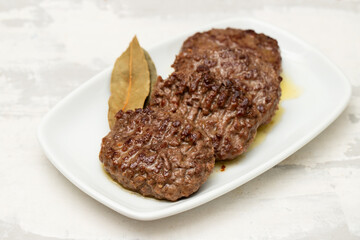 three fried ground meat on white plate