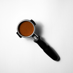 coffee and magnifying glass on white