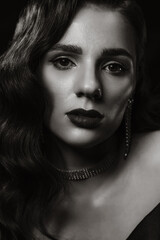 Portrait of woman in classic vintage noir image. Photo of girl in retro style of black and white Hollywood movies.
