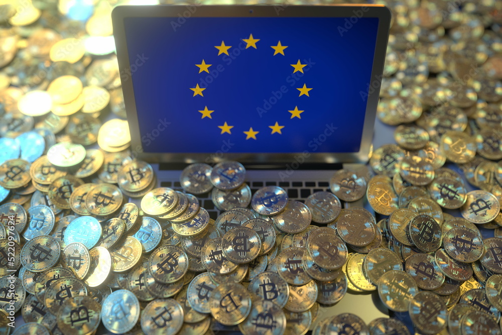 Aufkleber flag of the european union eu on the laptop screen and many bitcoins. cryptocurrency regulations and