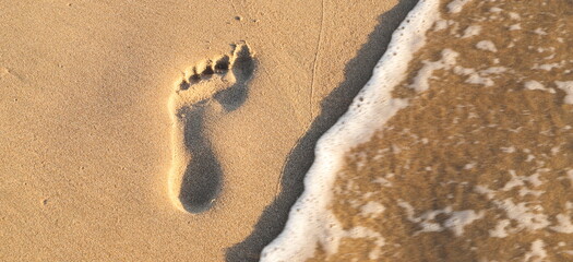a footprint in the sand on the North Sea coast