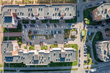 Chaotic parking in the courtyard of an apartment building top aerial view