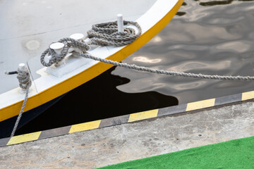 Bollards with mooring ropes are on a ships deck