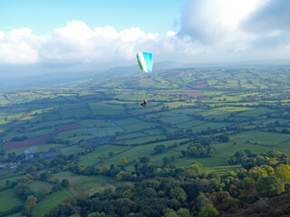 	
Paragliders flying above the ridge at Pandy, Wales