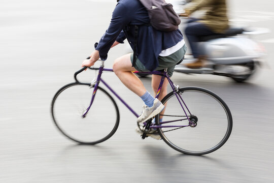 person riding a bicycle in a traffic scene
