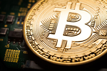 Bitcoin coin on green circuit background. Cryptocurrency, virtual money. Blockchain technology, bitcoin mining concept.
