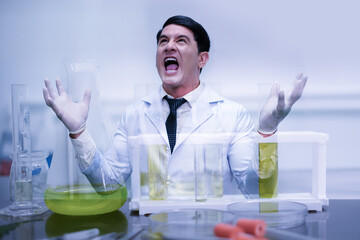 Crazy scientist in laboratory. Mad scientist inventor concept. Frustrated upset research man feeling tired worried with problem in chemical laboratory.