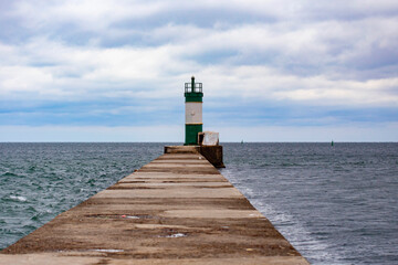 Beautiful striped lighthouse on cloudy day in Chornomorsk, Ukraine
