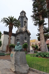 Fototapeta na wymiar Puerto de la Cruz, Tenerife, Canary Islands, Spain, May 27, 2022: Monument to Agustin de Betancourt y Molina in front of the church of our lady of the rock of France in Puerto de la Cruz, Tenerife