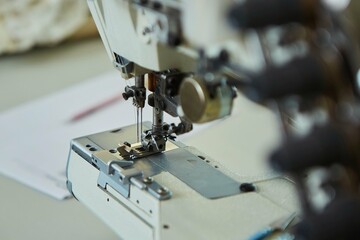Industrial sewing production or atelier. Sewing machines for creating clothes.