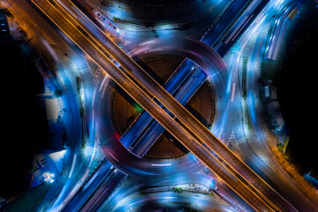 car traffic transportation above circle roundabout road in Asian city. Drone aerial view fly in circle, high angle. Public transport or commuter city life concept	
