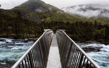 Likholefossen waterfall in Norway with spectacular steel bridge