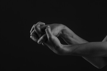 close-up hand massage on a dark background