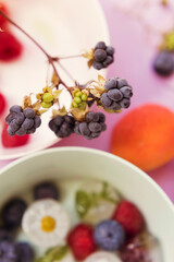 Ice cubes with berries and flowers