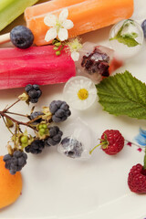 Colorful popsicles on tray close up