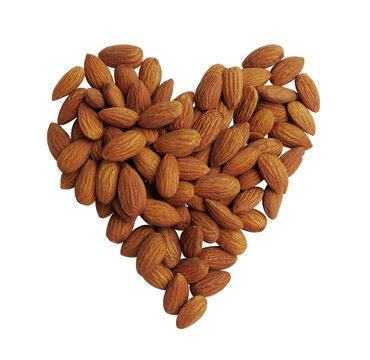 Peeled almonds closeup heart shape