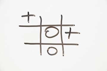 Tic Tac Toe is drawn in black on white, the Tic Tac Toe game