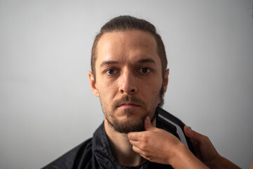 Young White Bearded Man gets his Beard Trimmed with a Razor