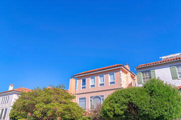 Trees at the front of residential buildings with modern mediterranean exterior at San Francisco, CA
