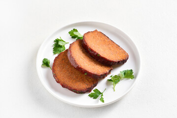 Sliced meatloaf on plate