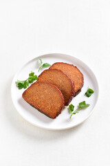 Sliced meatloaf on plate