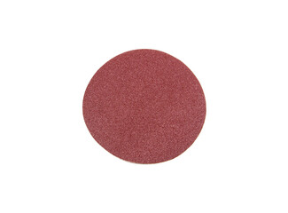 Round sandpaper of red color, used for removing impurities from various materials.