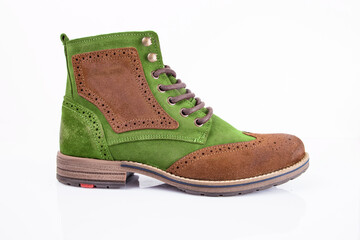 Male green and brown leather boot on white background, isolated product. Differentiated footwear and exclusive design.