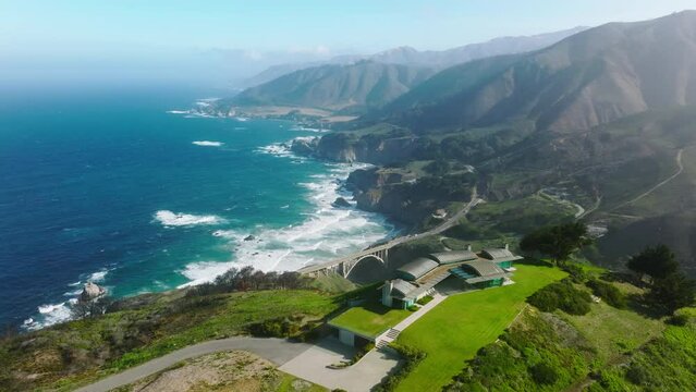 Beautiful Big Sur coast with road running from South to North California by cinematic landscape. Scenic route form Los Angeles to San Francisco popular among tourists. Luxury property ocean view house