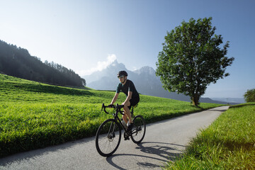 Road cyclist climbing the Italian Dolomites