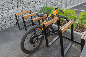 Fototapeta na wymiar Electric bicycle parked to bike rack