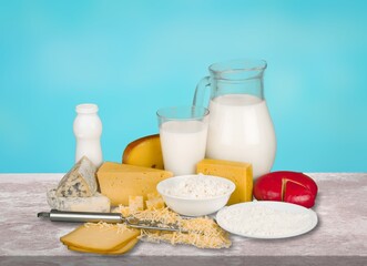 Shavuot with dairy products and wheat on light background, Happy Jewish Shavuot holiday