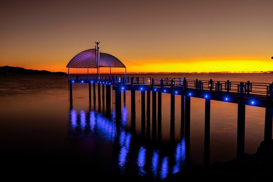 Beautiful Sunset On The Townsville Strand Beachfront With Lights On The Deck