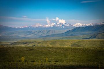 Obraz premium suussamyr valley in kyrgyzstan, mountain landscape, central asia, green valley, pasture