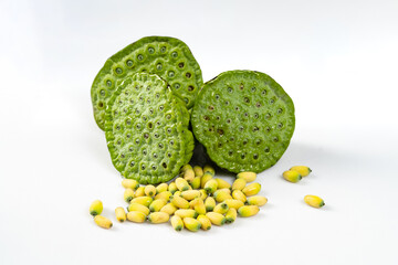 Fresh lotus seeds on a simple background