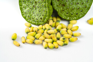 Fresh lotus seeds on a simple background