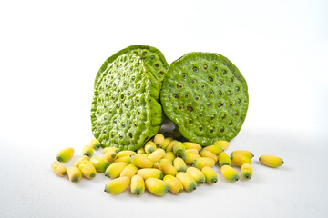 Fresh lotus seeds on a simple background